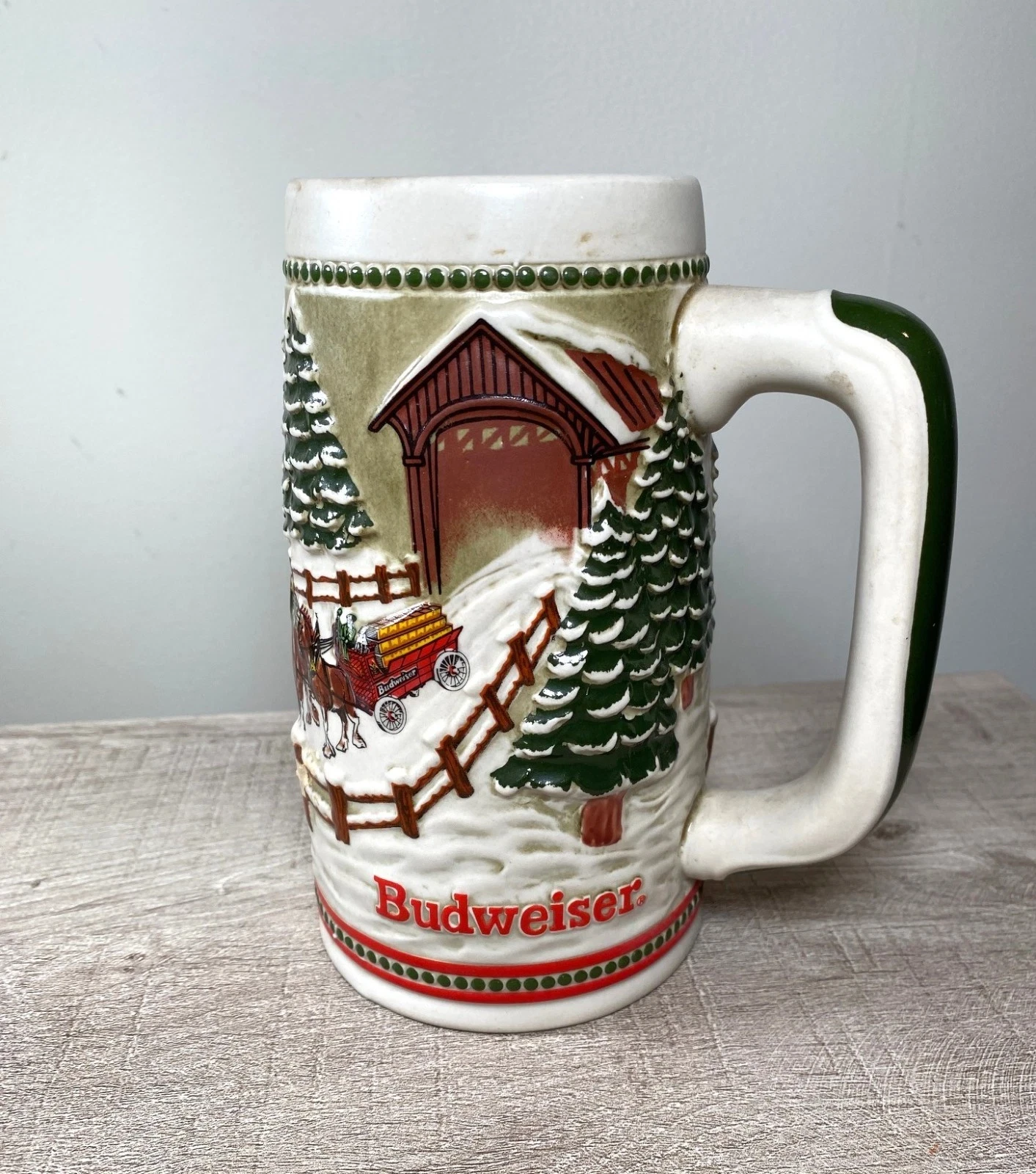 Budweiser ceramic beer stein with a winter covered bridge scene